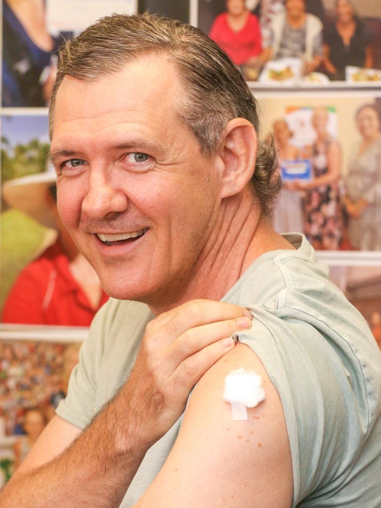 NT Chief Minister Michael Gunner receives his Covid-19 vaccination booster shot at a pharmacy. Picture: Glenn Campbell