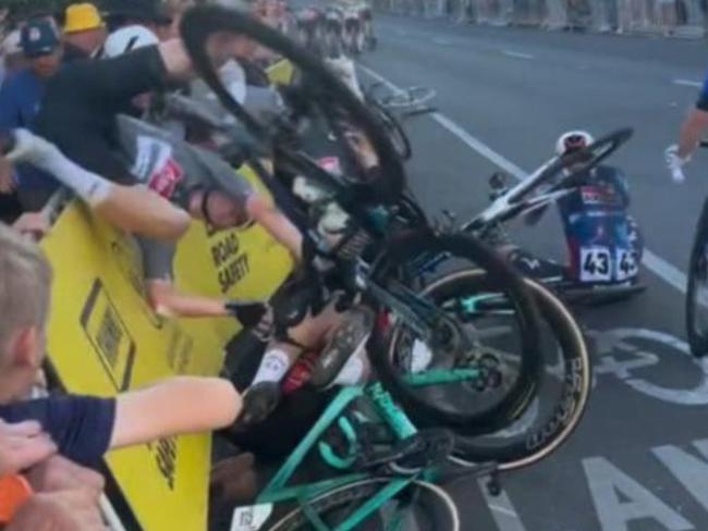 A devastating crash has marred Saturday’s Tour Down Under, leaving a fan hospitalized with serious injuries.