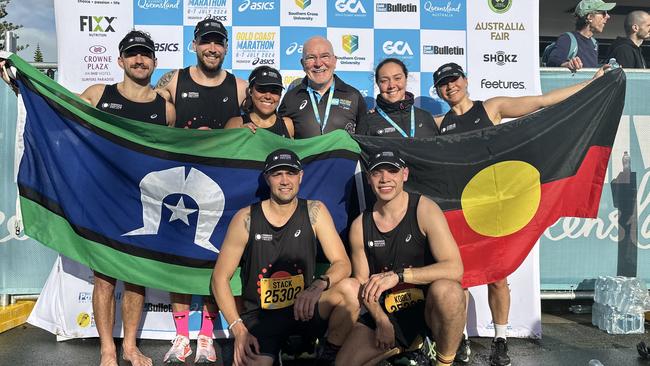 Dakota Manton, Millie Telford, Angelica Gee, Koolyn Briggs, Della Bedford, Shannon Stack, with Rob de Castella at the Gold Coast Marathon. Photo: Ash Jansen