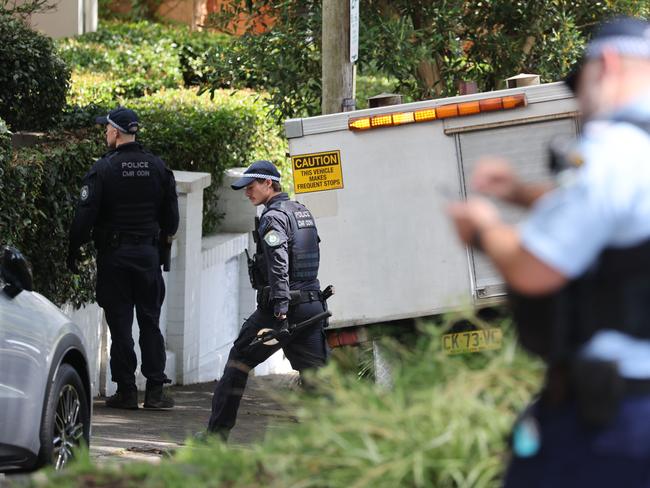 The Daily Telegraph 11.12.2025 Police do a line search on the street at the scene. Firebombing in  Magney Street Woollahra. Picture: Rohan Kelly