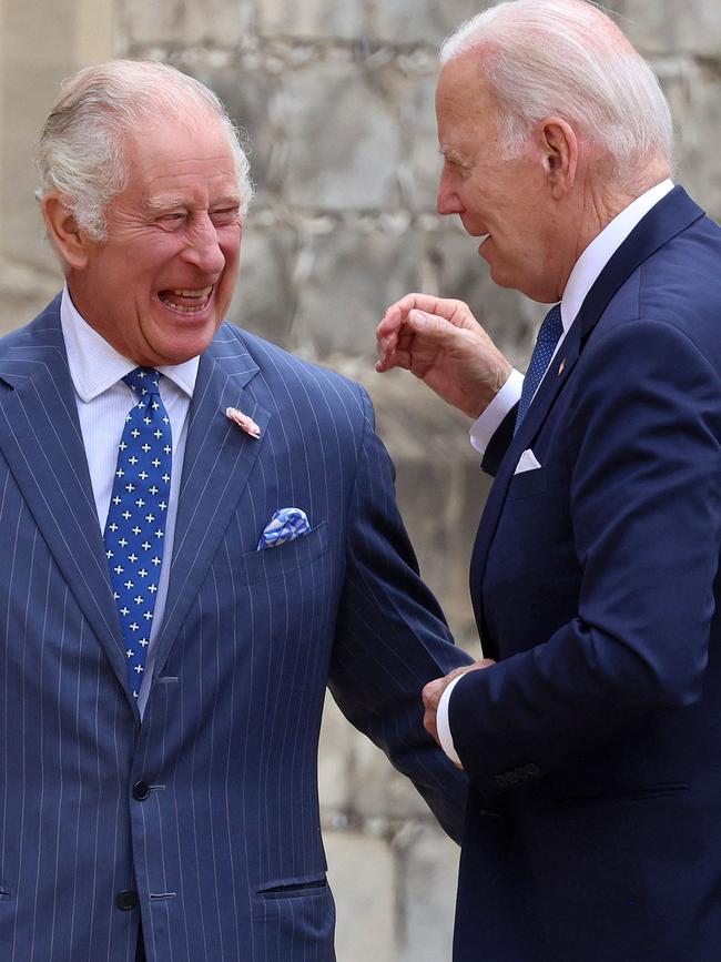 US President Joe Biden, right, and King Charles III talk at a ceremonial welcome in the Quadrangle at Windsor Castle in July. Picture: AFP