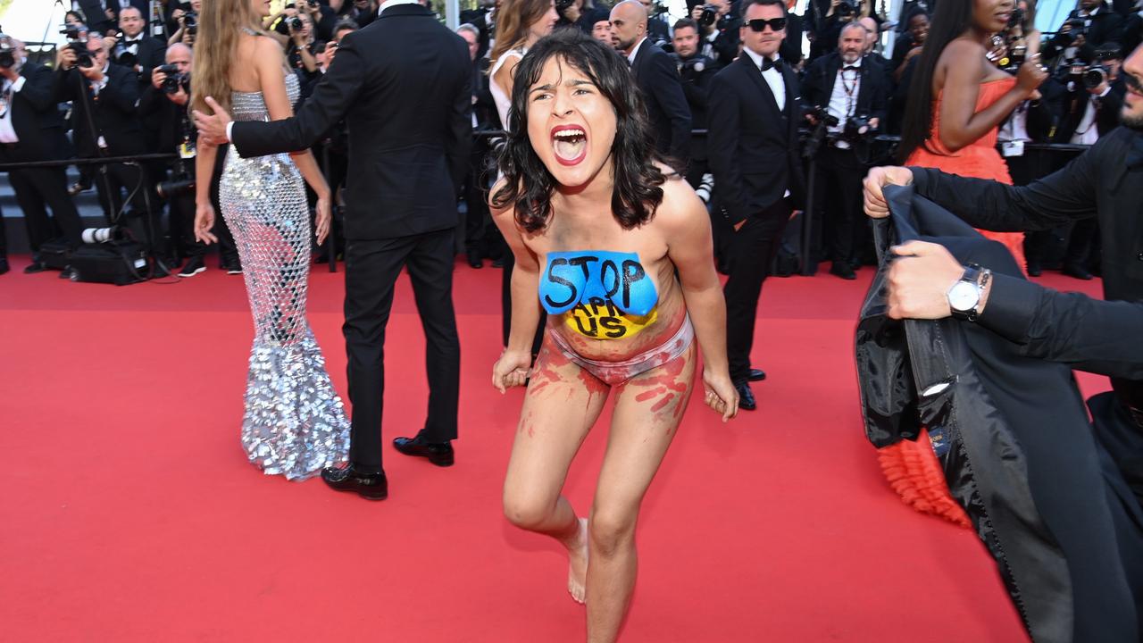 A protester has appeared on the red carpet during the <i>Three Thousand Years Of Longing</i> premiere at Cannes Film Festival. Picture: Pascal Le Segretain/Getty Images