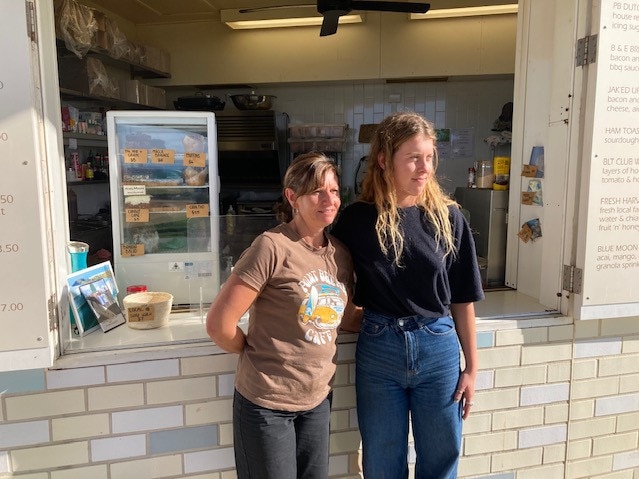 Point Break Cafe owner Mel Coram, left, with staff member Hannah Woodham at Crescent Head. Pic Dan Mills