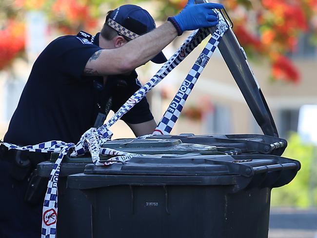 Queensland Police and forensic team scour the area around a unit complex behind a construction site on 22 Archer Street in Toowong after a report of a deceased person was located earlier this morning. Pictures: Jack Tran