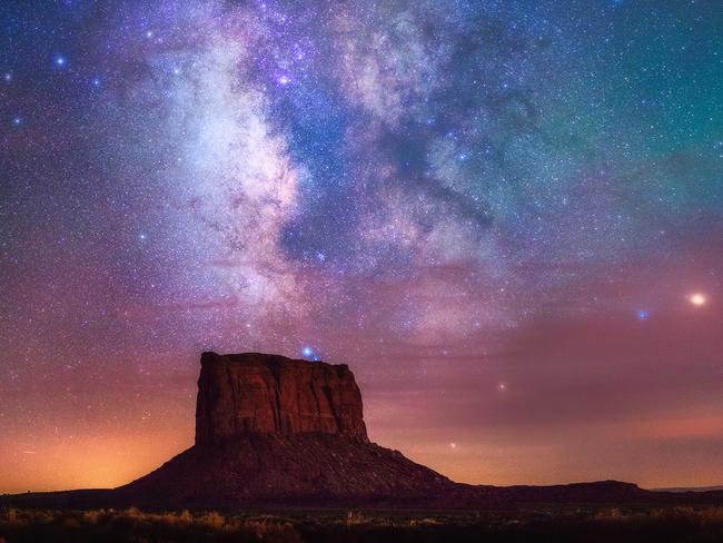 Monument Stars © Albert Dros Despite being taken during the Lunar Eclipse of 2015 the photographer actually didn't shoot the moon, but took the opportunity to capture the amazing dark sky that presented itself. Coming from a country (the Netherlands) with so much light pollution, this marked the first time the photographer had seen the Milky Way so clearly. The red glow in the sky is from the extraordinary atmosphere during the Lunar Eclipse, and the photographer remarked that it was, ‘An experience I will never forget.’ This shot is a panorama comprised of 3 vertical shots. Monument Valley, United States