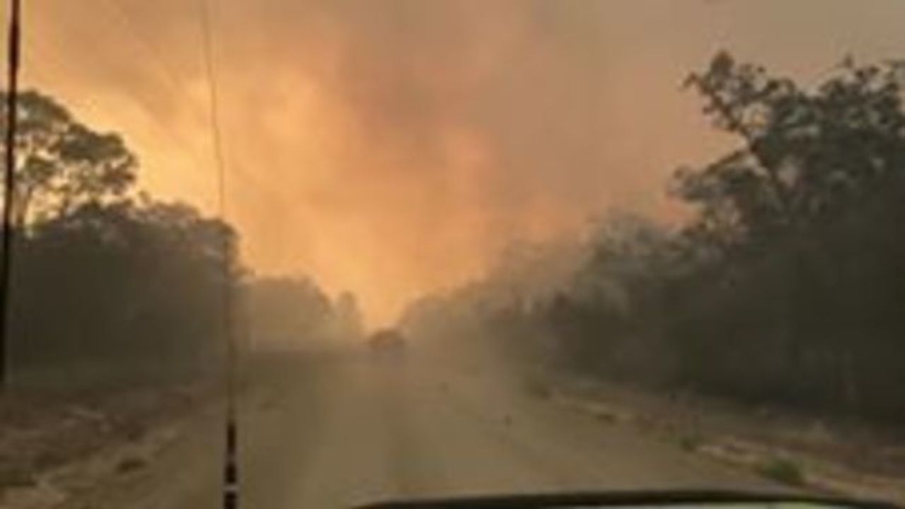 Ambulance Crew Drives Through Thick Smoke From Queensland Bushfires