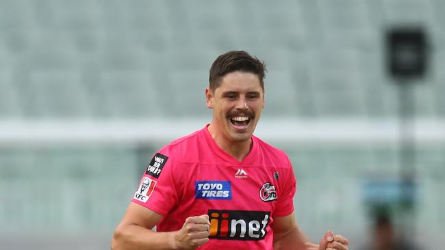 CORRECTED VERSION: MELBOURNE, AUSTRALIA – JANUARY 26: Ben Dwarshuis of the Sixers celebrates after dismissing Marcus Stoinis of the Stars during the Big Bash League match between the Melbourne Renegades and Hobart Hurricanes at Melbourne Cricket Ground, on January 26, 2021, in Melbourne, Australia. (Photo by Mike Owen/Getty Images)