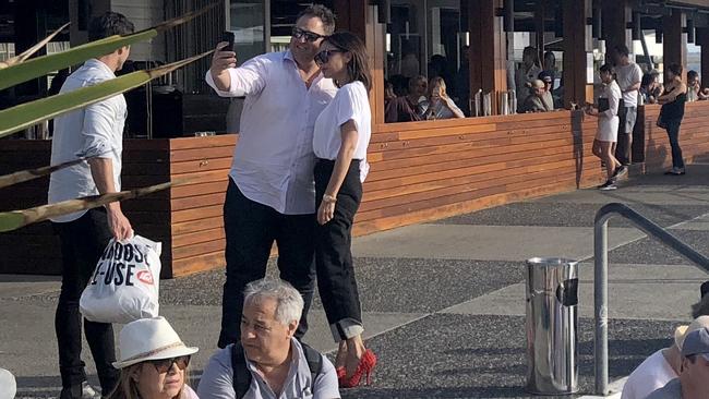 Victoria Beckham with a selfie-seeking fan during her visit to Sydney’s Manly Beach. Picture: Manly Daily/Andrea McCullagh