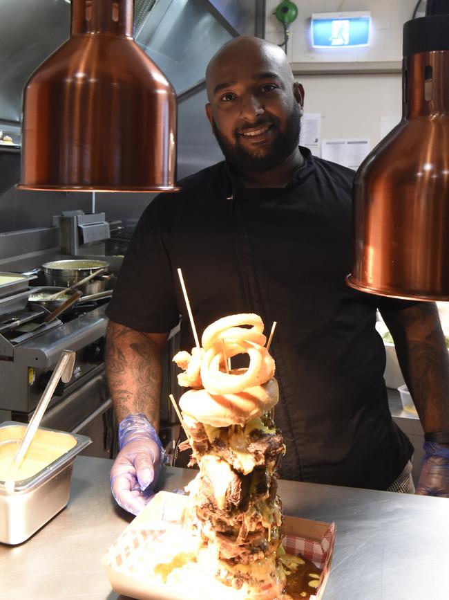 Head Chef and Owner of District North Kitchen, Dhanushka Marasingha with his 1.5kg monster burger