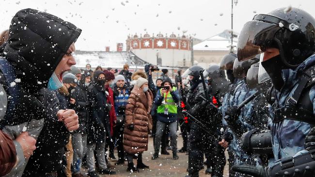 Protesters face off against police in protests in Moscow on Sunday. Picture: Reuters.