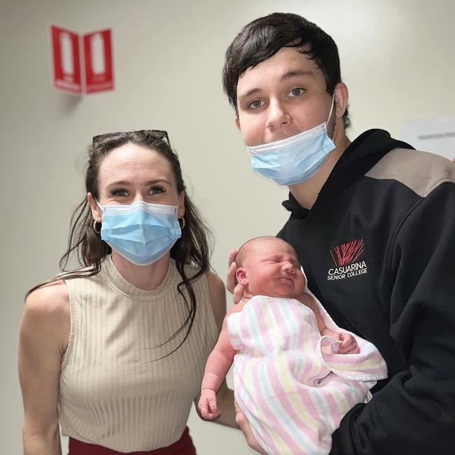 18-year-old Kingsley 'Junior' Alley holding his newborn daughter Eleanor, with step-mum Kylie Simmonds. Kingsley was murdered at Palmerston on October 8.