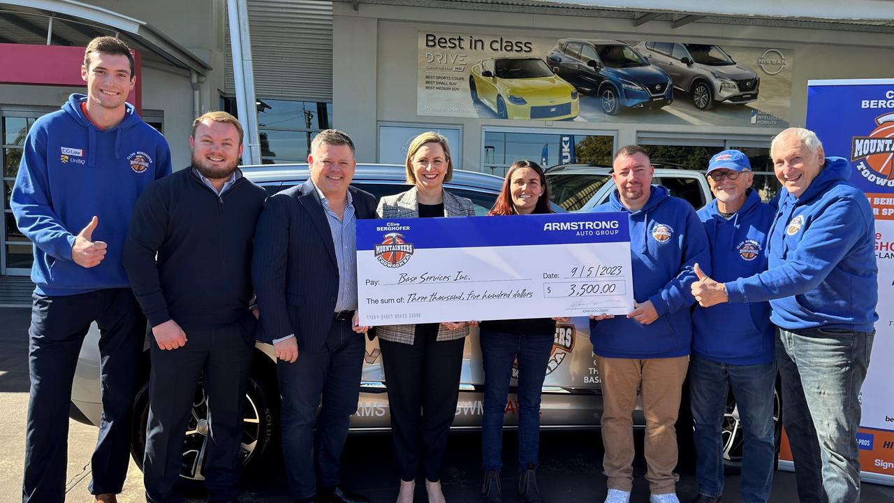 Representatives from the Toowoomba Mountaineers and Armstrong Auto Group donate funds to Base Services Toowoomba.