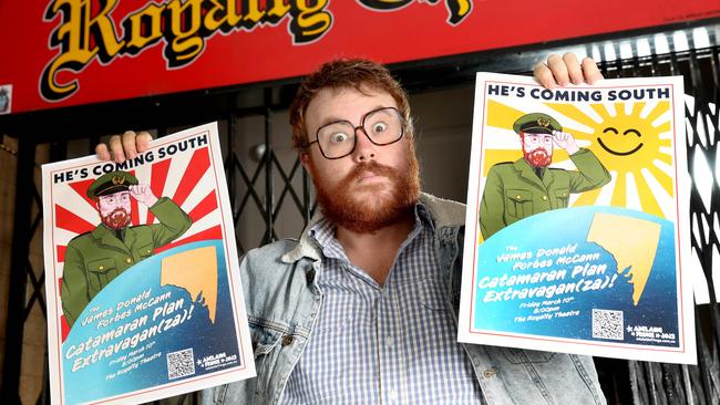 Comedian James Donald Frobes McCann outside Royalty Theatre with both of the posters. Picture: Dean Martin