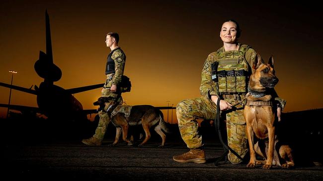 Royal Australian Air Force, Military Working Dog Handler Leading Aircraftwoman Brooke Hitchinson with dog Karma (forward), works closely with her Royal New Zealand Air Force counterpart Leading Aircraftman Byron Buys with dog Kaiser, at RAAF Base Darwin during Exercise Pitch Black 2022. Picture: LACW Kate Czerny