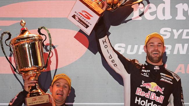 Jamie Whincup (left) celebrates his second-placed in Saturday night’s night race with Red Bull Racing teammate Shane van Gisbergen.