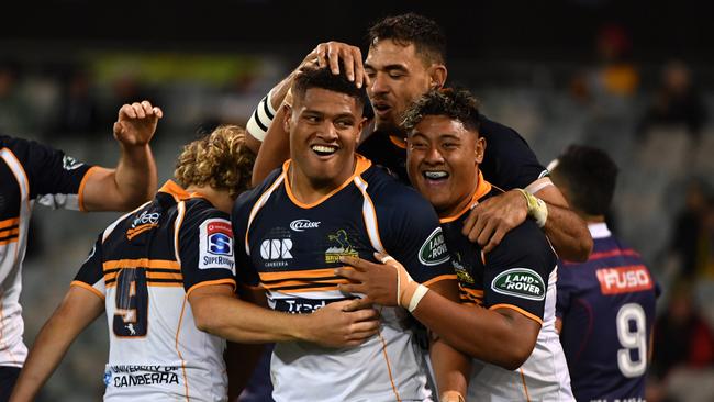 Rob Valentini of the Brumbies (centre) celebrates after scoring a try during the Round 13 Super Rugby match between the Brumbies and the Melbourne Rebels at GIO Stadium in Canberra, Saturday, May 12, 2018. (AAP Image/Mick Tsikas) NO ARCHIVING, EDITORIAL USE ONLY