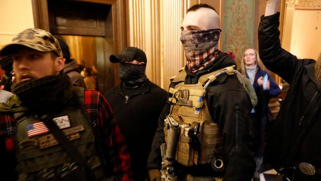 Protestors try to enter the Michigan House of Representative chamber.