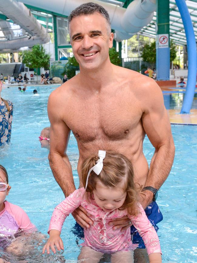 Premier Peter Malinauskas winning the state election with his daughter Eliza at the Adelaide Aquatic Centre. Picture: Brenton Edwards