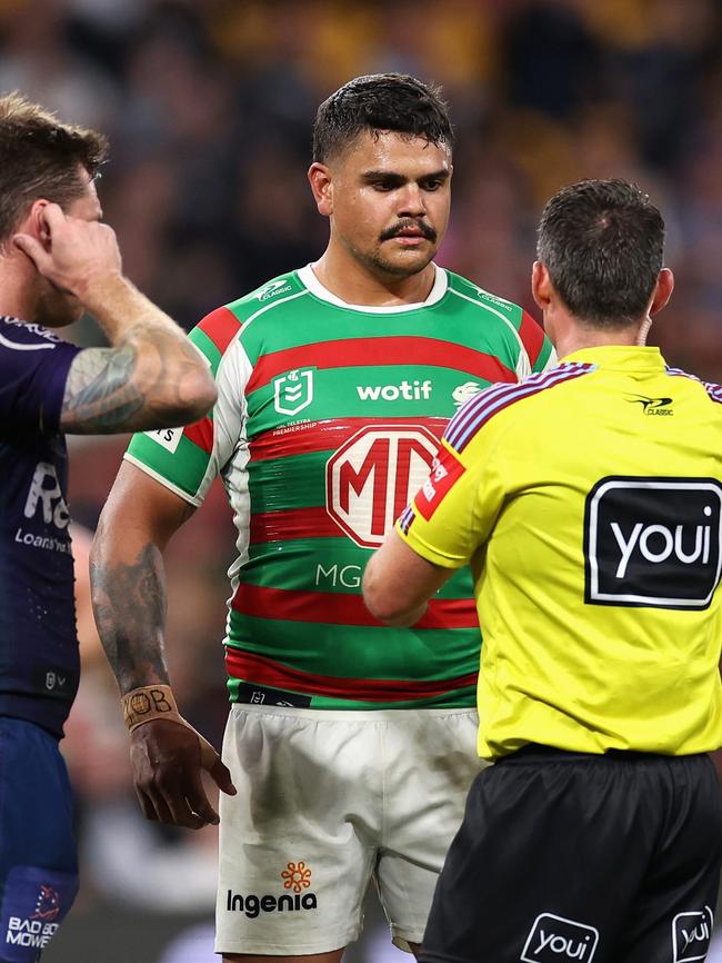 Referee Adam Gee talks to Latrell Mitchell.