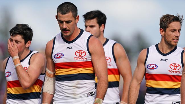 Taylor Walker of the Crows and his teammates leave the field after the Round 23 loss to the Bulldogs in Ballarat. Picture: AAP Image/Scott Barbour