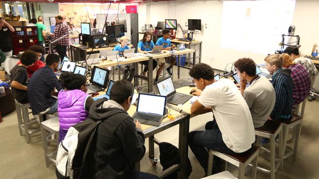 Young students at Microsoft's Garage work on their personal projects.