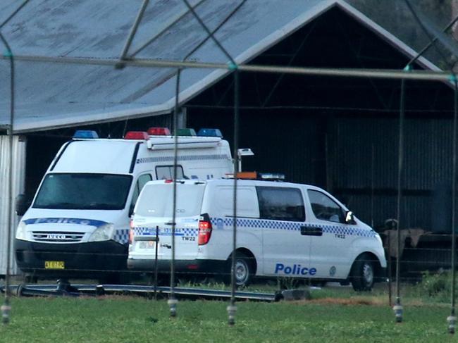 Investigators near the farmhouse where the alleged murder took place. Picture: Nathan Edwards