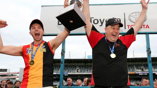 Heath Jamieson (right) has coached five flags at suburban level. Picture: Mike Dugdale