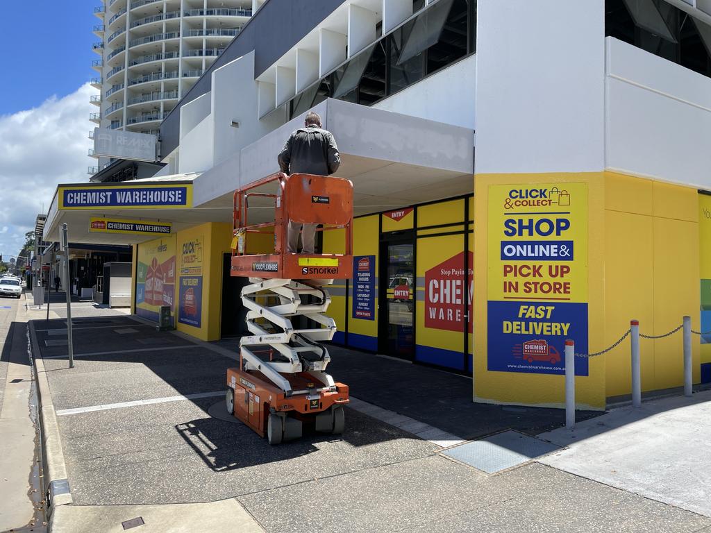 Sign-writer installs signage at the new Chemist Warehouse store at 121-133 Sturt St. Picture: Leighton Smith.