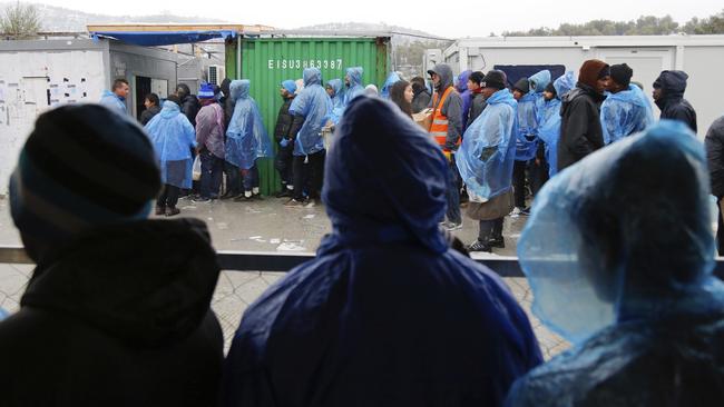 Refugees and migrants queue as they wait for food at Moria refugee camp in Lesbos, Greece. (Pic: Petros Tsakmakis/InTime News via AP)