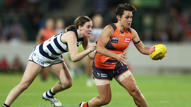 Former GWS player Courtney Gum is challenged by Geelong’s Denby Taylor during a match this season. Picture: Matt Kind/Getty Images