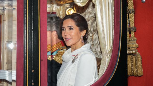 They left in the 19th century royal carriage made of black mahogany, decorated in red silk velvet with gold embroidery and tassels. Picture: Emil Helms / Ritzau Scanpix / AFP)