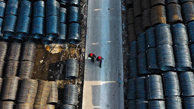 An aerial view shows people walking at a wholesale steel market in Shenyang, in northeastern China's Liaoning province on April 11, 2024. (Photo by AFP) / China OUT