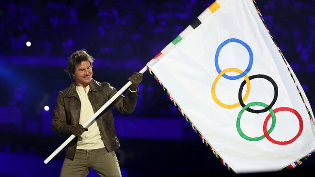 Cruise was seen waving the Olympic flag during the Closing Ceremony. Photo: Fabrizio Bensch- Pool/Getty Images.