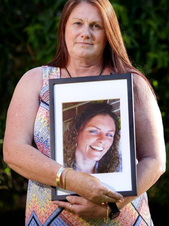 Debbie Roberts holds a photo of daughter Amy Aiton. Picture: Troy Snook