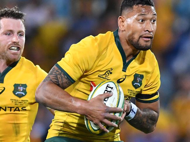 Israel Folau (right) and Bernard Foley (left) of the Wallabies take on the Pumas defence only to loose the ball on full time during the Rugby Championship match between Australia and Argentina at Cbus Super Stadium on the Gold Coast, Saturday, September 15, 2018. (AAP Image/Darren England) NO ARCHIVING, EDITORIAL USE ONLY
