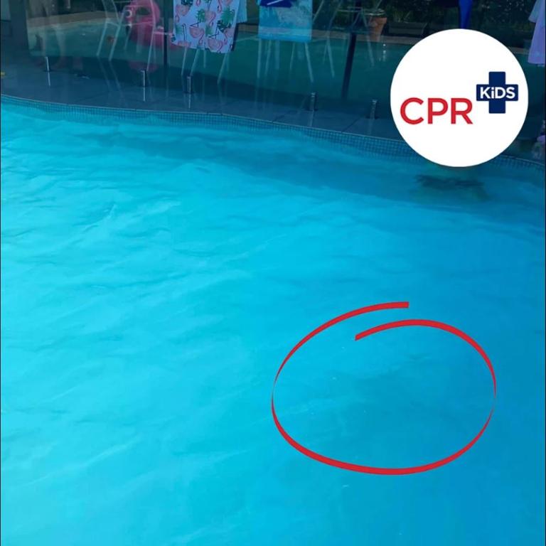 A slightly darker patch in the water was all that suggested a child was beneath the surface. Picture: @CPRKids / Facebook