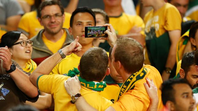 SYDNEY, AUSTRALIA - JANUARY 31: Australian fans celebrate after Australia won the 2015 Asian Cup final match between Korea Republic and the Australian Socceroos at ANZ Stadium on January 31, 2015 in Sydney, Australia. (Photo by Mark Nolan/Getty Images)