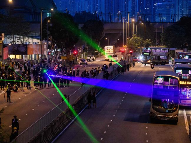 Protesters use laser pointers in the Tai Wai area of Hong Kong on August 10. Picture: Anthony Wallace/AFP