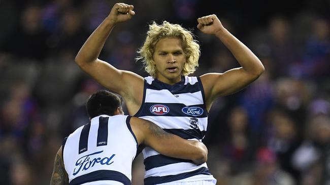 Quinton Narkle and Tim Kelly celebrate Narkle’s first AFL goal.