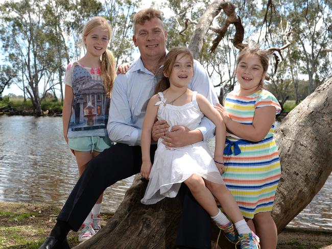 Medallist Aaron Derby is pictured with daughters Charlotte and Chelsea and niece Sienna Derby.