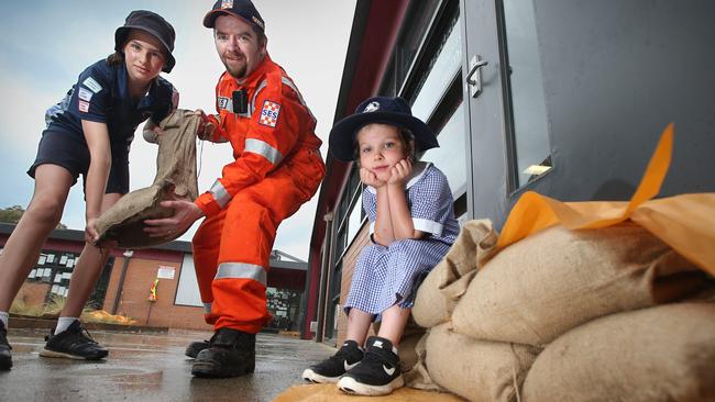 SES Sandbagging at Ocean Grove primary school Noel Kelleher (Bellarine SES) with students Veronica yr6 and Phoebe yr1, doing some preventive sandbagging at Ocean Grove Primary ahead of today's storms. picture: Glenn Ferguson