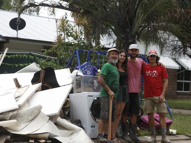 Cecile Dehant (second from left) and friends Lalo, Mathieu Carlot and Jonathan Richer, who were helping with the clean up at Mullumbimby on March 4, 2022. Picture: Liana Boss
