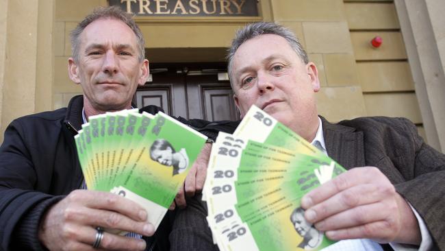 An initiative by the Community and Public Sector Union (CPSU) and the Health and Community Services Union has been set up to encourage workers to pass out fake $20 Lara Giddings emblazoned notes, from left, Tim Jacobson and CPSU general secretary Tom Lynch with the mock currency