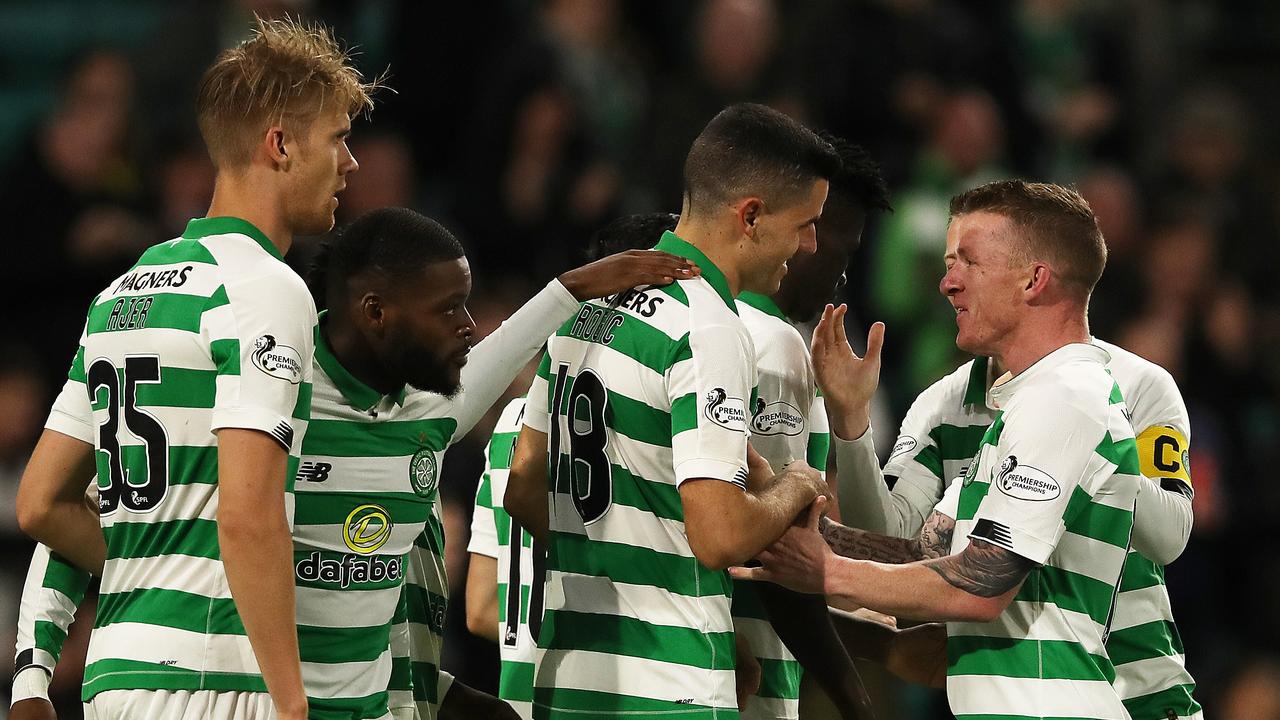 Tom Rogic (C) of Celtic mobbed by teammates after scoring on his first start of the season. (Photo by Ian MacNicol/Getty Images)