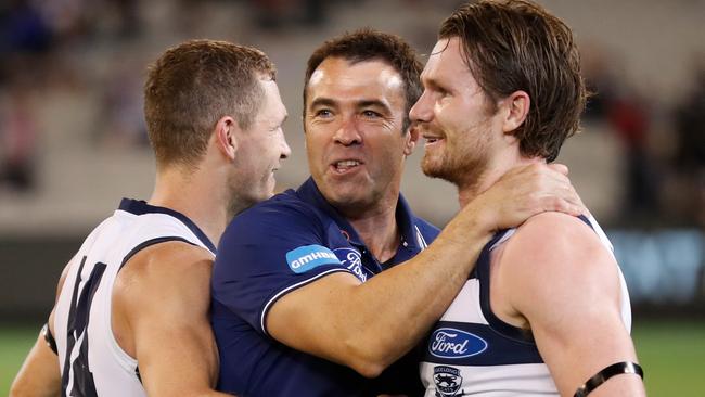 Joel Selwood, Chris Scott and Patrick Dangerfield celebrate after Geelong’s Round 1 win over Collingwood. Picture: AFL Photos