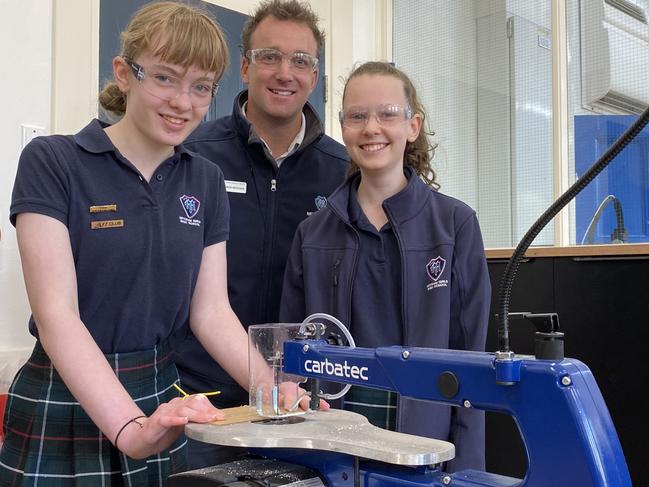 Mitcham Girls High School STEM teacher Simon Brooks with Year 7 students Madeleine Schiller and Tea Conry. Picture: Chris Russell