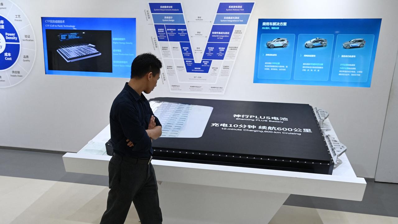 A visitor looks at a Shenxing Plus battery pack for electric vehicles in the showroom at the headquarters of Chinese EV battery maker CATL. Picture: AFP