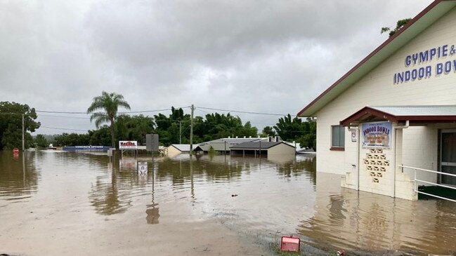 The shops around Brisbane Rd and Graham St were submerged by floodwaters from Deep Creek.