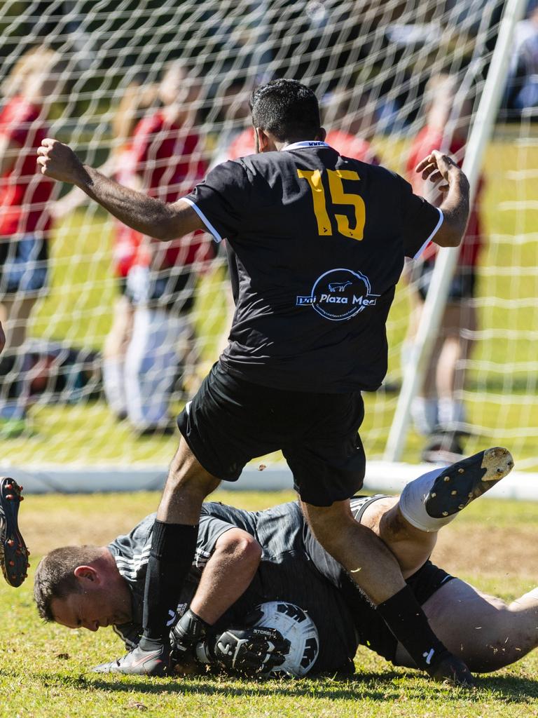 Willowburn keeper Alex Saunders makes a save under pressure from Krishant Kishor of West Wanderers in U23 men FQ Darling Downs Presidents Cup football at West Wanderers, Sunday, July 24, 2022. Picture: Kevin Farmer