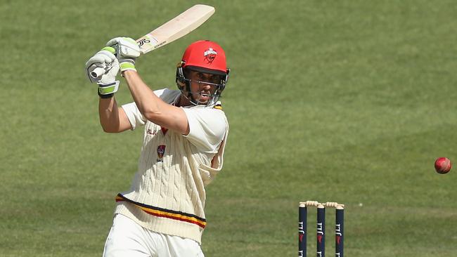 Australian Test aspirant Jake Lehmann smashes the ball through the covers for four on his way to his first innings century against Victoria at the MCG. Picture: Michael Dodge (Getty Images).